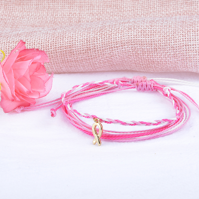 Rosafarbenes Schleifenband-Armband zur Aufklärung über Brustkrebs. Geschenke für Frauenliebe